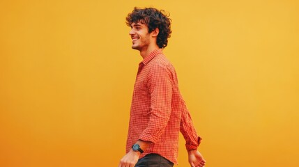 Wall Mural - A person wearing a bright red shirt walks on a path or street, potentially heading somewhere