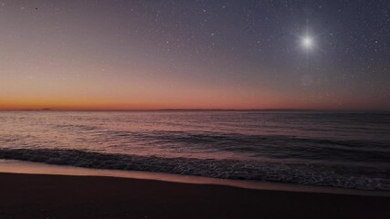 Wall Mural - night christmas panorama with a star in the sky on the beach