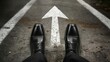 ©   - Facing the Direction: A low-angle shot presents a person in formal shoes standing before an upward-pointing arrow painted on the road. The image speaks to decisions, journey and future path