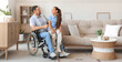 © Pixel-Shot - Little girl and her father sitting in wheelchair at home