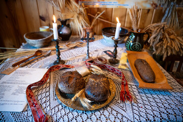 Traditional Eastern European Table Setting with Bread and Candles