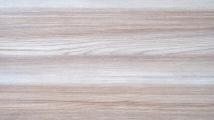 Aufkleber - A wooden surface with a grain pattern. The grain is visible in the wood. The surface is light in color