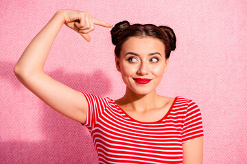 Wall Mural - Close up photo beautiful she her lady pretty buns look side empty space hold hand arm finger above hairstyle recommend stylist wear casual striped red white t-shirt isolated pink background