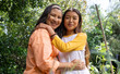 © Wavebreak Media - Grandmother and asian female teenager hugging in garden, enjoying sunny day