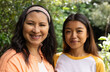 © Wavebreak Media - Grandmother and asian female teenager smiling together outdoors, enjoying family time in garden