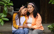 © Wavebreak Media - Comforting asian female teenager on porch, grandmother sharing heartfelt moment together, bonding