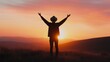 © vinod - silhouette of a person celebrating at sunset in nature