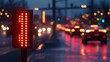 © harryaishi - A traffic light displays red, with cars illuminated and reflections on a wet road at dusk.