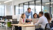 © Htet Wai Phyo - Out-of-Focus Team Discussion in Office