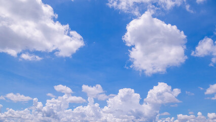 Wall Mural - clear blue sky background,clouds with background, Blue sky background with tiny clouds. White fluffy clouds in the blue sky. 
Captivating stock photo featuring the mesmerizing beauty of the sky and cl