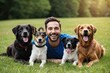 © Michael - Happy Man Enjoying Relaxation in Grass with Pet Dogs