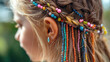 © JCreative - child hair is intricately braided with colorful beads, creating vibrant and playful look. bright beads add touch of whimsy and charm to hairstyle, perfect for joyful occasion