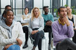© Katsiaryna - young business people listening to a lecture in the conference hall.