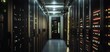 © CHONCHANOK PHOTO - High-tech server room with illuminated data storage racks and modern equipment for network management.