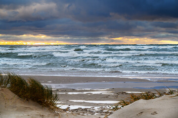 Wall Mural - First snow on Baltic sea beach, Liepaja, Latvia.