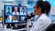 © leszekglasner - Female doctor conducting scientific video conference using computer talking to other doctors on screen