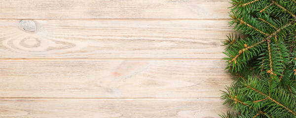 Wall Mural - Christmas gray wooden background with fir tree and copy space. top view empty space for your design
