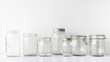 © Channarong - Empty glass jars various sizes clean minimalist simple storage containers mason jars glass transparent home decor kitchen pantry organization recycling reuse sustainable lifestyle arrangement display