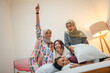 © Odua Images - Friends share laughter and joyful moments during a fun pillow fight, creating memories