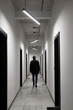 © Maya Kruchancova - man in black jacket in modern corridor