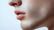 © Obee - 1. A close-up view of a male human face structure, showcasing the jawline and cheekbones, on a white background
