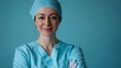 © Pedro - Smiling doctor. Healthcare service. Medical employee. Friendly cheerful caring woman surgeon in hospital uniform isolated on blue