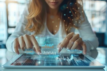 Leinwandbilder - Female fintech entrepreneur at workspace, analytics on digital table tablet, clean and modern office space.