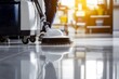 © Gophotograph - The indoor environment showcases a janitor at work with a floor polishing machine.