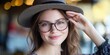 © Alla - A woman wearing glasses and a hat, suitable for use in illustrations or photographs