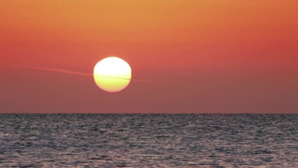 Wall Mural - timelapse sunrise over calm sea landscape