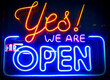 © Savvapanf Photo © - Yes, we're open - glowing neon sign board on glass window during night time