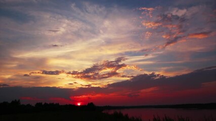 Wall Mural - beautiful landscape with dramatic sunset on river, timelapse 4k