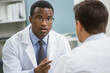 © Mselected - Medical consultation between a doctor and patient in a clinical setting