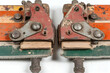 © Putu - Vintage industrial machinery components, close-up detail of rusty red and green metal parts with worn wooden elements.  Ideal for industrial, mechanical, or vintage design projects.
