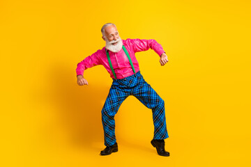 Wall Mural - Full body photo of retired man dancing good mood dressed pink shirt vintage plaid pants fancy clothes isolated on yellow color background