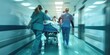 © Svetlana Leuto - an ambulance crew carries a patient on a gurney, intensive care doctors, uniformed medical personnel transport patients along the hospital corridor