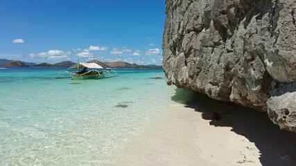 Wall Mural - beautiful view of tropical philippines island. white sand beach and boat in bay with turquoise water