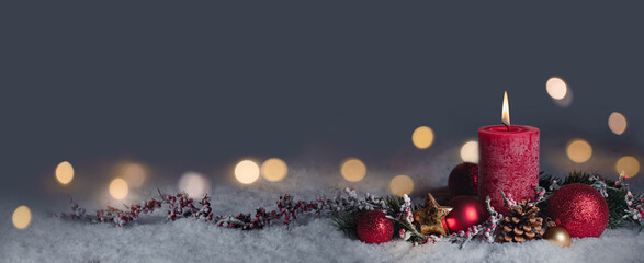 Wall Mural - red christmas candle - first advent sunday - 1. advent or xmas decoration with snow background and m
