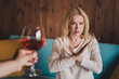 © deagreez - Photo of confident serious woman dressed beige shirt showing stop gesture drinking alcohol indoors house apartment room