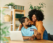 © Lumos sp - couple credit woman laptop shopping card online technology internet payment computer young man love together order happy