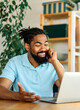 © Lumos sp - man computer laptop business working home businessman internet office smart phone smartphone mobile call online young desk communication casual black african american entrepreneur