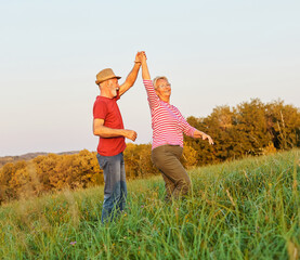 Wall Mural - woman man outdoor senior couple happy lifestyle retirement together smiling love dancing nature matu