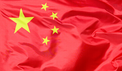 Wall Mural - Close-up of the national flag of China, fluttering in the wind with folds, wave pattern