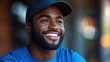 ©  Dreamy Shots - Close-up of cheerful man in a blue shirt and cap smiling confidently outdoors, glowing with positivity and relaxed casual vibe, natural lighting, happiness