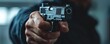 © nakarin - Confrontation with a firearm urban setting action image dramatic lighting close-up view safety awareness