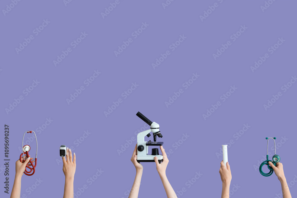 Hands with stethoscopes, microscope, pills and glucometer on lilac background