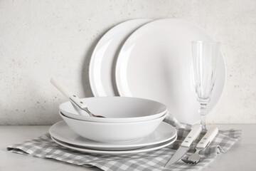 Wall Mural - Set of light stylish tableware on white background