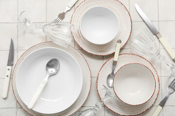 Wall Mural - Set of plates and cutlery on white background