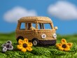 © Ai DreamscapesTH - Adorable Knitted Camper Van Toy on Grass Summer Fun Crochet Travel