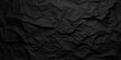 © Planetz - Crumpled Black Paper Texture Ideal for Backgrounds, Overlays, and Artistic Projects with Unique Detail and Depth